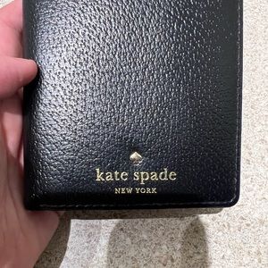 Like new Kate Spade passport holder in black.